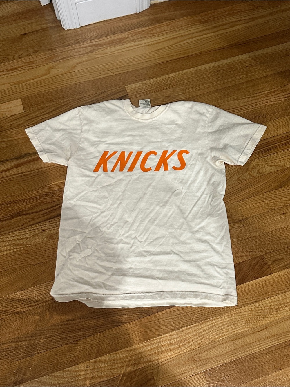 KNICKS ivory Graphic Tee with Orange Logo